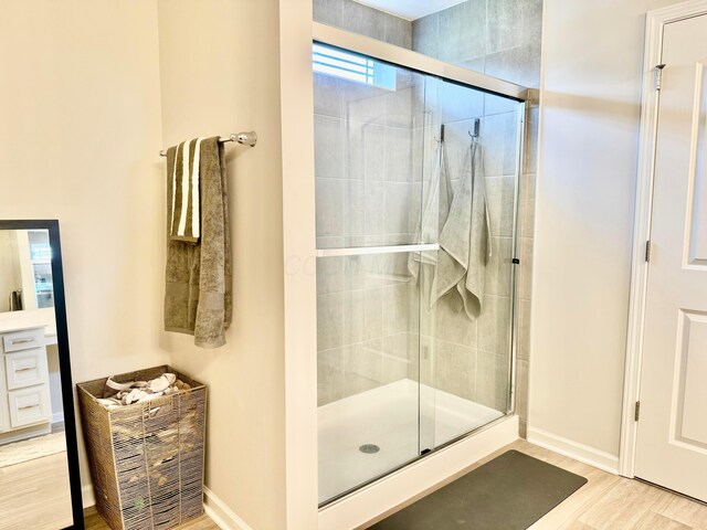 3895 Brody Dr, Grove City, OH 43123 - bathroom with a stall shower, wood finished floors, and baseboards