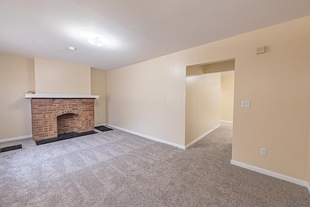 1121 Oakwood Ave, Columbus, OH 43206 - unfurnished living room featuring carpet floors, baseboards, and a fireplace