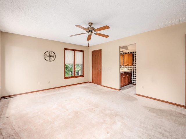 5434 Flat Head Ct, Columbus, OH 43230 - unfurnished room featuring a ceiling fan, baseboards, light colored carpet, and a textured ceiling