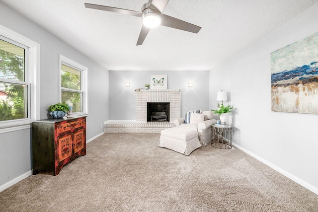 1058 Erickson Ave, Columbus, OH 43227 - living area with carpet flooring, a brick fireplace, ceiling fan, baseboards, and a textured ceiling