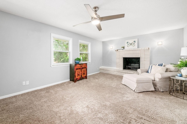 1058 Erickson Ave, Columbus, OH 43227 - carpeted living room with ceiling fan, baseboards, and a brick fireplace
