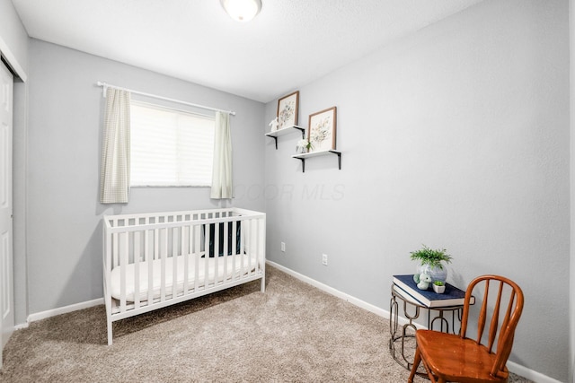 1058 Erickson Ave, Columbus, OH 43227 - bedroom with carpet flooring, baseboards, a nursery area, and a closet
