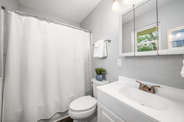 1058 Erickson Ave, Columbus, OH 43227 - full bathroom with a textured ceiling, toilet, and vanity