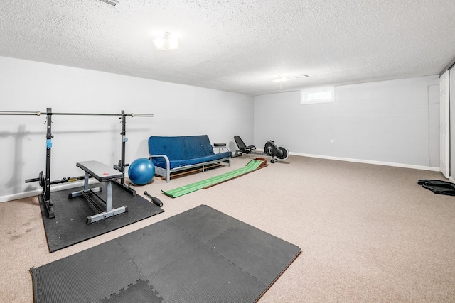 1058 Erickson Ave, Columbus, OH 43227 - exercise room with a textured ceiling, baseboards, and carpet floors