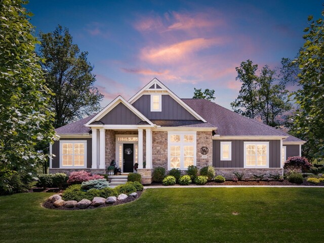 2235 Forestview Ln, Delaware, OH 43015 - craftsman inspired home featuring board and batten siding, stone siding, and a lawn