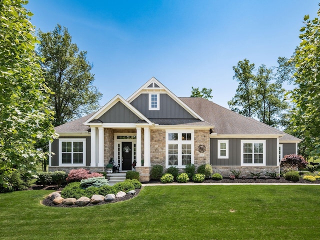 2235 Forestview Ln, Delaware, OH 43015 - craftsman house with board and batten siding, stone siding, and a front yard