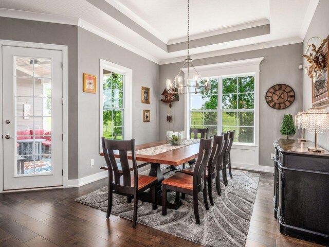 2235 Forestview Ln, Delaware, OH 43015 - dining area featuring plenty of natural light, a chandelier, dark wood finished floors, and crown molding