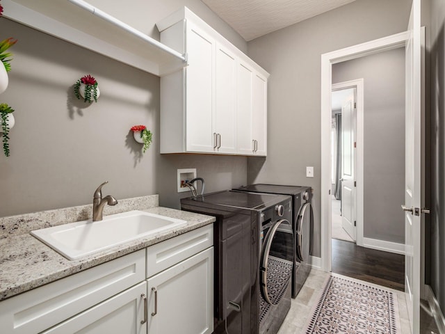 2235 Forestview Ln, Delaware, OH 43015 - washroom with cabinet space and independent washer and dryer
