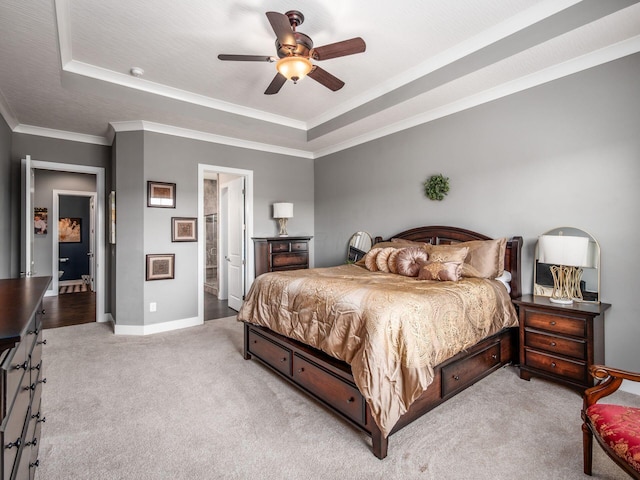 2235 Forestview Ln, Delaware, OH 43015 - bedroom with a tray ceiling, light carpet, ornamental molding, ceiling fan, and connected bathroom