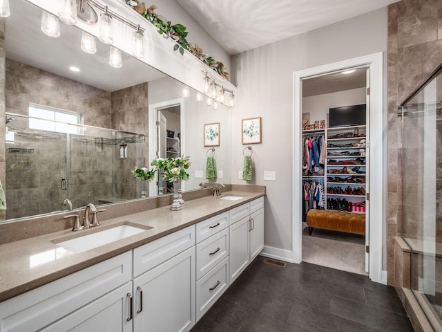2235 Forestview Ln, Delaware, OH 43015 - full bathroom with a spacious closet, double vanity, a shower stall, and tile patterned flooring