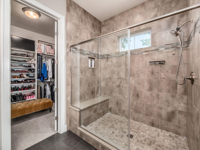 2235 Forestview Ln, Delaware, OH 43015 - full bath with a shower stall, tile patterned flooring, and a walk in closet