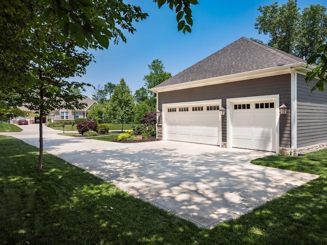 2235 Forestview Ln, Delaware, OH 43015 - view of side of property with a lawn, a shingled roof, concrete driveway, and an attached garage