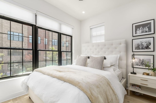 312 Cornelius St, Columbus, OH 43215 - bedroom featuring multiple windows, wood finished floors, and recessed lighting