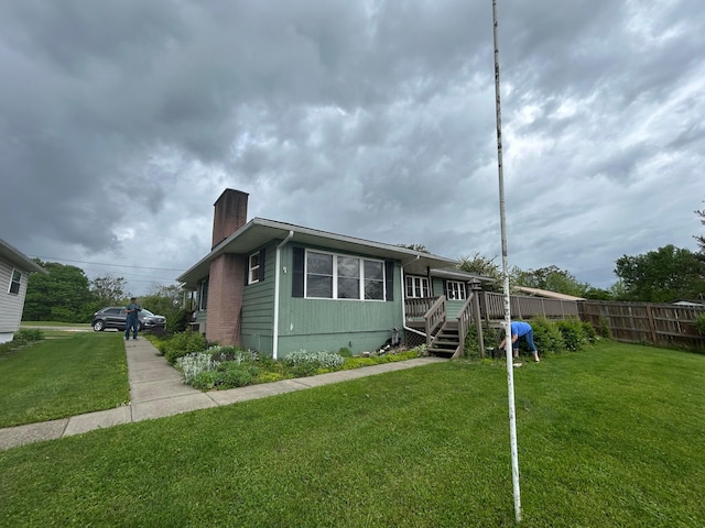 3049 Palace Heights Ln NW, Malta, OH 43758 - view of front facade featuring a chimney and a wooden deck