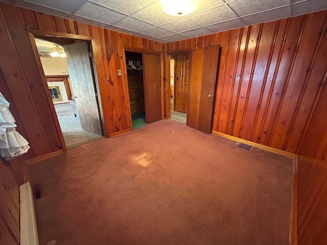 3049 Palace Heights Ln NW, Malta, OH 43758 - carpeted spare room with wooden walls and baseboards