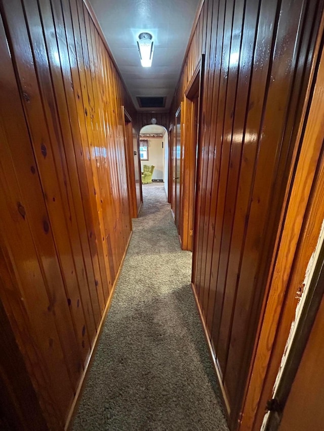 3049 Palace Heights Ln NW, Malta, OH 43758 - hallway with carpet floors, arched walkways, and wood walls