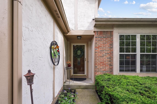 388 Slate Run Dr, Powell, OH 43065 - property entrance with stucco siding and brick siding