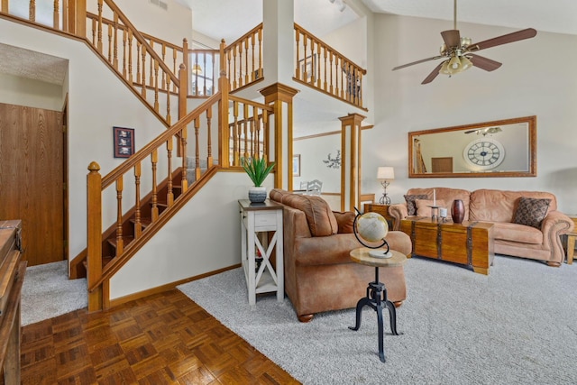 388 Slate Run Dr, Powell, OH 43065 - living room featuring high vaulted ceiling, a ceiling fan, baseboards, and stairway