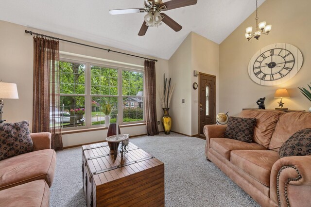 388 Slate Run Dr, Powell, OH 43065 - living area featuring carpet, baseboards, ceiling fan, high vaulted ceiling, and a chandelier