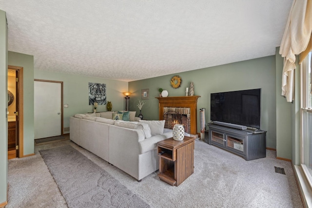 388 Slate Run Dr, Powell, OH 43065 - living area featuring carpet flooring, a textured ceiling, a brick fireplace, and baseboards