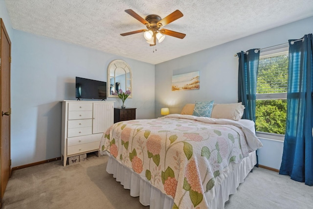 388 Slate Run Dr, Powell, OH 43065 - bedroom with light carpet, baseboards, a textured ceiling, and ceiling fan