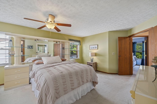 388 Slate Run Dr, Powell, OH 43065 - bedroom featuring multiple windows, light carpet, baseboards, a textured ceiling, and a ceiling fan