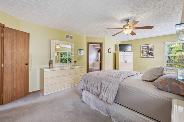 388 Slate Run Dr, Powell, OH 43065 - bedroom featuring light colored carpet, a textured ceiling, a ceiling fan, and ensuite bathroom