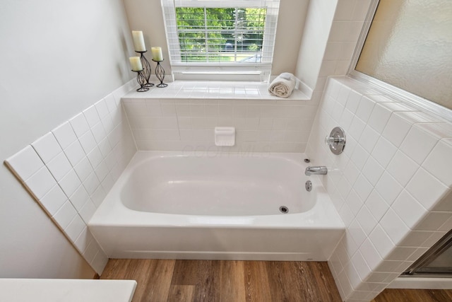 388 Slate Run Dr, Powell, OH 43065 - bathroom featuring wood finished floors and a garden tub