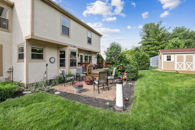 388 Slate Run Dr, Powell, OH 43065 - view of green lawn featuring an outdoor fire pit and a patio area