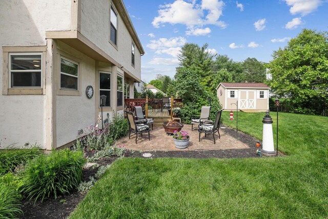 388 Slate Run Dr, Powell, OH 43065 - view of grassy yard featuring an outdoor fire pit and a patio