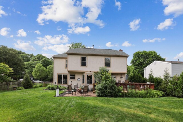 388 Slate Run Dr, Powell, OH 43065 - back of house featuring stucco siding and a patio area