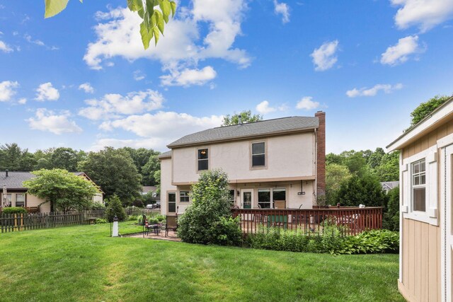 388 Slate Run Dr, Powell, OH 43065 - back of house featuring stucco siding, a chimney, a patio, and a wooden deck