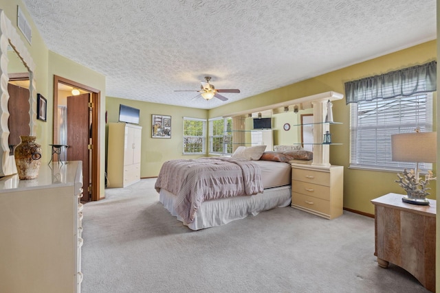 388 Slate Run Dr, Powell, OH 43065 - bedroom featuring light colored carpet, a textured ceiling, ceiling fan, and baseboards