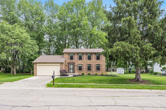544 Waring Way, Columbus, OH 43213 - colonial inspired home featuring concrete driveway, a garage, brick siding, and a front yard