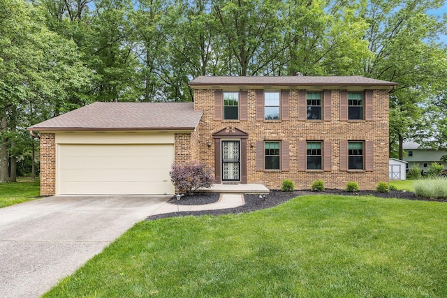 544 Waring Way, Columbus, OH 43213 - colonial home with a garage, brick siding, a front lawn, and concrete driveway