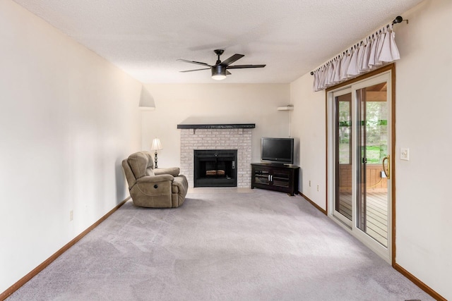 544 Waring Way, Columbus, OH 43213 - unfurnished living room with ceiling fan, baseboards, light carpet, a brick fireplace, and a textured ceiling