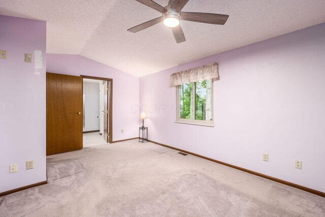 544 Waring Way, Columbus, OH 43213 - carpeted spare room with lofted ceiling, ceiling fan, baseboards, and a textured ceiling