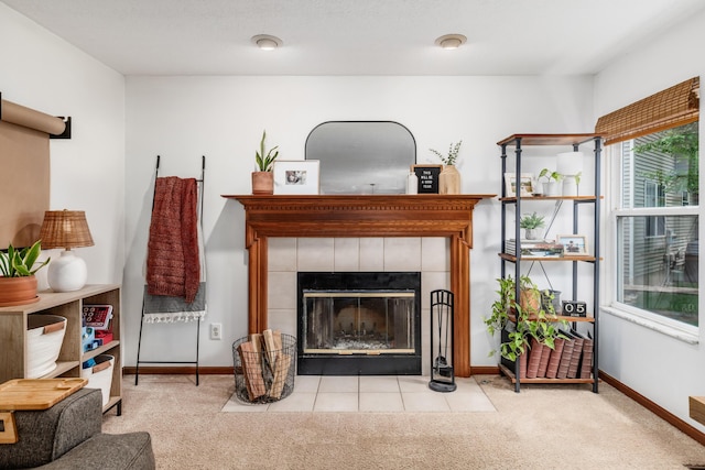 121 Persimmon Ct, Delaware, OH 43015 - living area featuring carpet, a tile fireplace, and baseboards