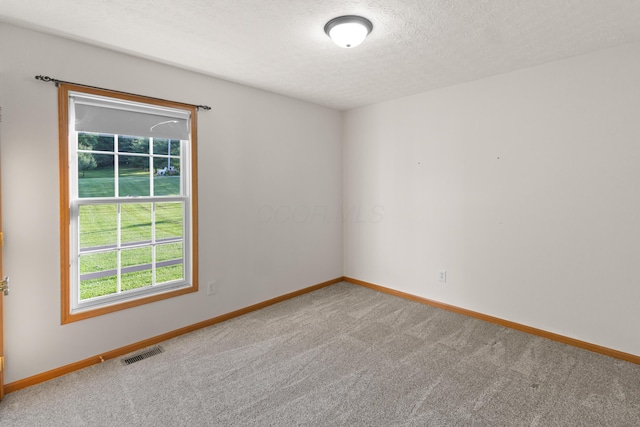 3040 Seney Rd Unit 912, Chillicothe, OH 45601 - unfurnished room featuring carpet flooring, baseboards, and a textured ceiling