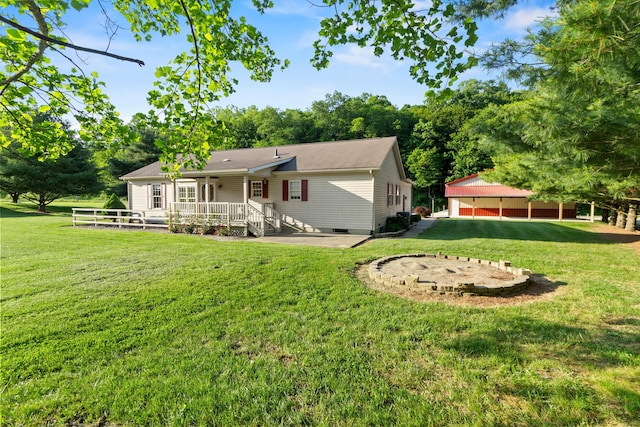 3040 Seney Rd Unit 912, Chillicothe, OH 45601 - back of house featuring a wooden deck, a yard, and an outdoor structure