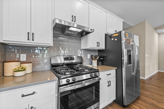 206 Rochdale Run, Delaware, OH 43015 - kitchen with appliances with stainless steel finishes, under cabinet range hood, baseboards, dark wood-style flooring, and decorative backsplash