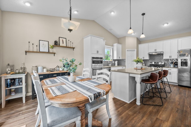 206 Rochdale Run, Delaware, OH 43015 - kitchen featuring appliances with stainless steel finishes, a center island, under cabinet range hood, tasteful backsplash, and white cabinets