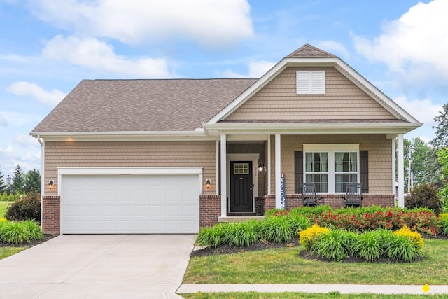 206 Rochdale Run, Delaware, OH 43015 - craftsman inspired home featuring brick siding, concrete driveway, a porch, an attached garage, and a shingled roof