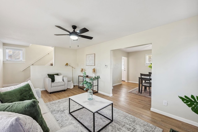2509 Perdue Ave, Columbus, OH 43211 - living room with healthy amount of natural light, baseboards, wood finished floors, and ceiling fan