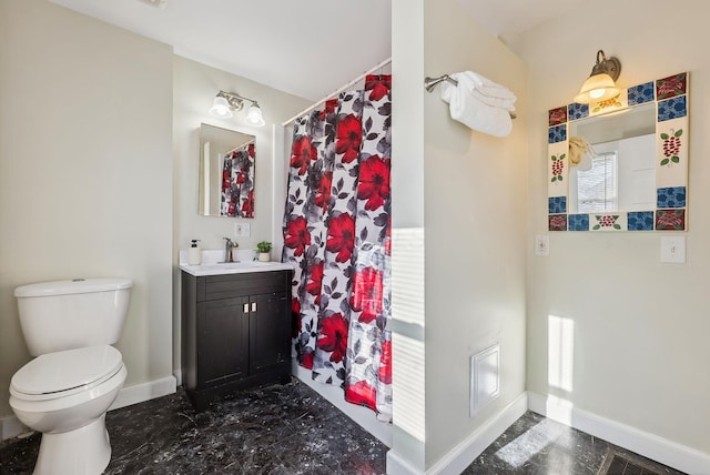 2509 Perdue Ave, Columbus, OH 43211 - bathroom featuring baseboards, toilet, and vanity