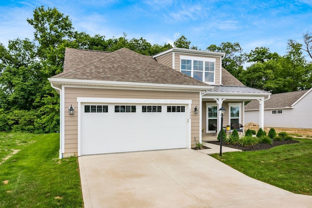 3446 Joberry Loop, Grove City, OH 43123 - view of front of house featuring a front yard, concrete driveway, a porch, a garage, and a shingled roof