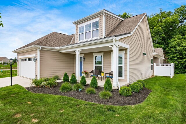 3446 Joberry Loop, Grove City, OH 43123 - view of front of property with covered porch, a garage, driveway, and roof with shingles