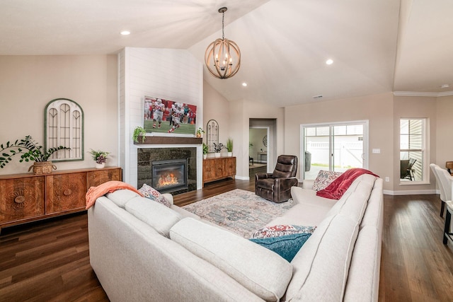 3446 Joberry Loop, Grove City, OH 43123 - living room with vaulted ceiling, a chandelier, dark wood-style flooring, a fireplace, and baseboards