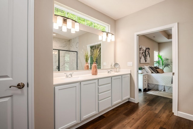 3446 Joberry Loop, Grove City, OH 43123 - ensuite bathroom featuring a marble finish shower, double vanity, wood finished floors, and baseboards