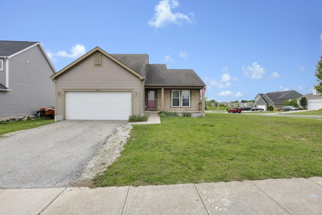 982 Margate Cir, London, OH 43140 - view of front of property featuring a garage, asphalt driveway, and a front lawn